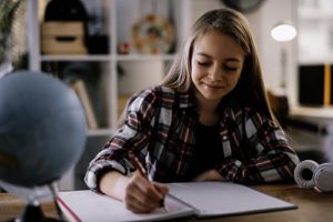 teen doing schoolwork through her academic program in Utah